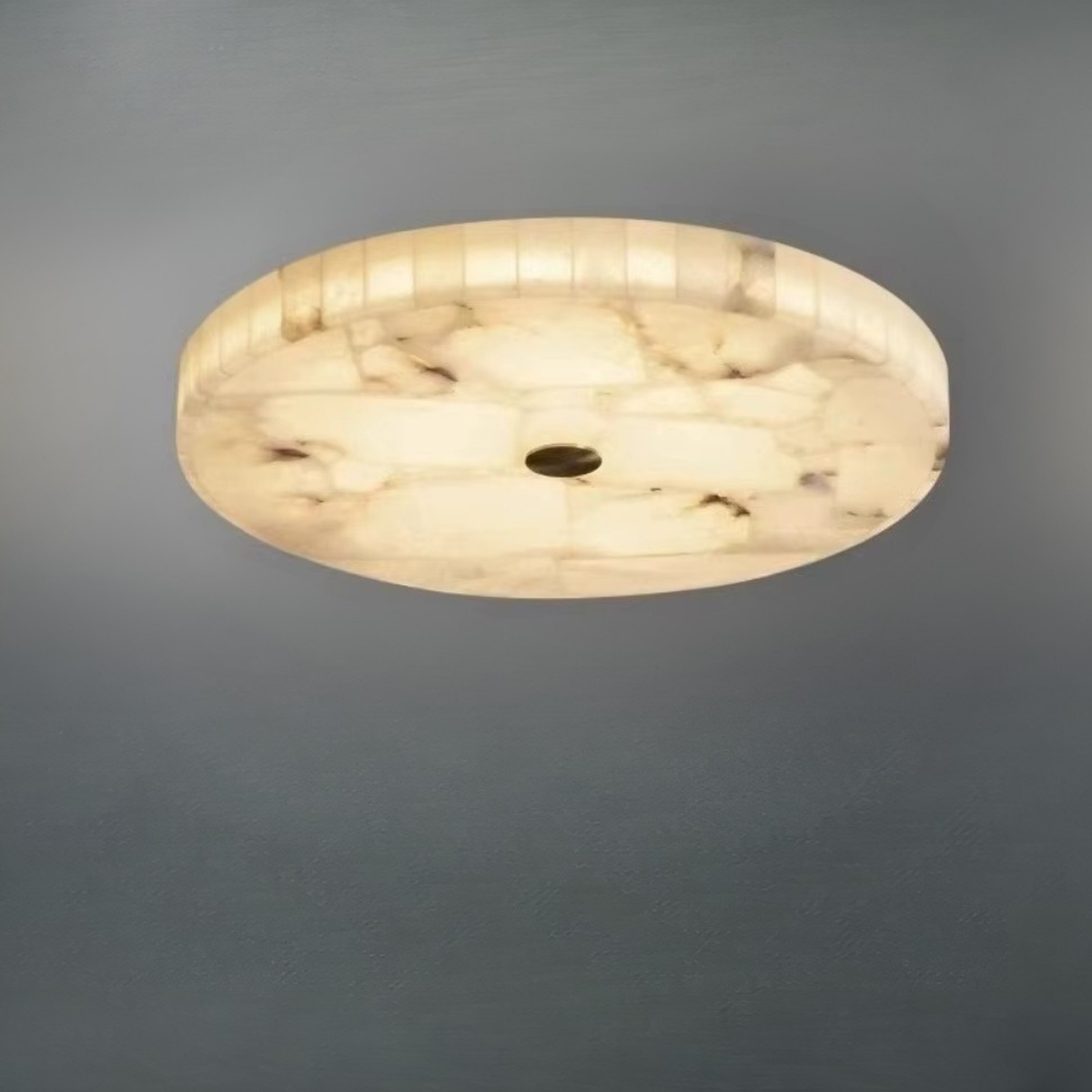 Alabaster flush ceiling light glowing warm white installed on ceiling - natural stone - Litora
