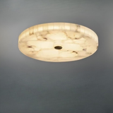 Alabaster flush ceiling light glowing warm white installed on ceiling - natural stone - Litora
