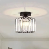 Round crystal bar drum ceiling light with black mount installed on a white ceiling - semi-flush crystal ceiling light - Litora