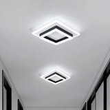 Two double square LED flush ceiling lights with black and white halo frames installed in a modern corridor - square LED ceiling light - Litora