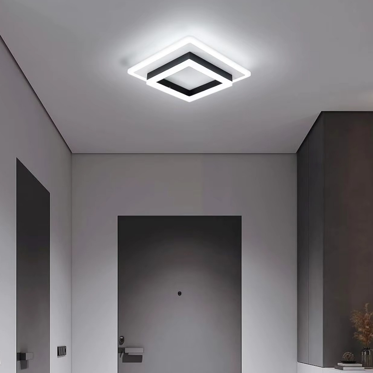 Double square LED flush ceiling light casting a bright halo effect in a dark modern hallway - minimalist LED ceiling light - Litora