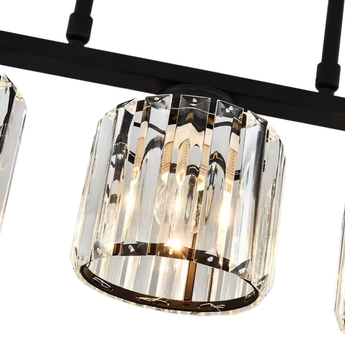 Close-up of faceted crystal cube shade with black metal fitting on a linear chandelier - cut crystal pendant detail - Litora