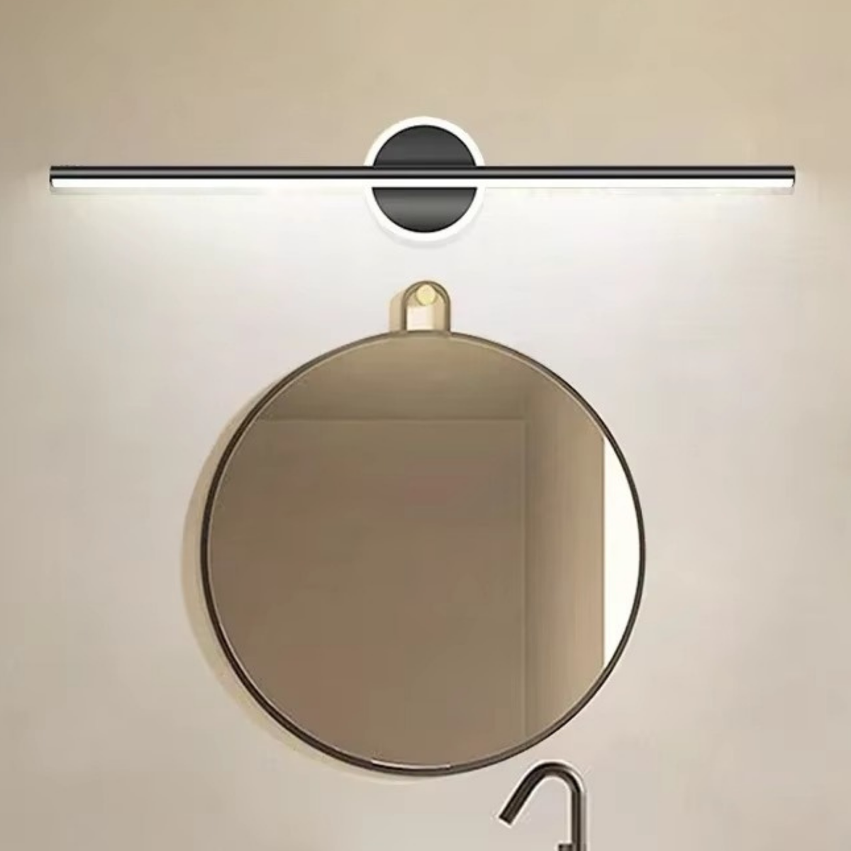 Black linear LED vanity light mounted above a round bathroom mirror over a white basin - modern bathroom wall light - Litora