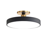 Round black disc LED semi-flush ceiling light with brushed brass fitting on white background - minimalist LED ceiling light - Litora