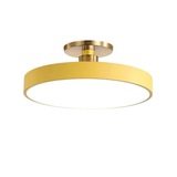 Round yellow disc LED semi-flush ceiling light with brass fitting on white background - colourful LED ceiling light - Litora