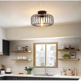 Black round wire cage flush ceiling light above a white subway tile kitchen with open shelving - industrial kitchen ceiling light - Litora
